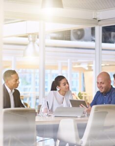 Team discussing strategy with tablet