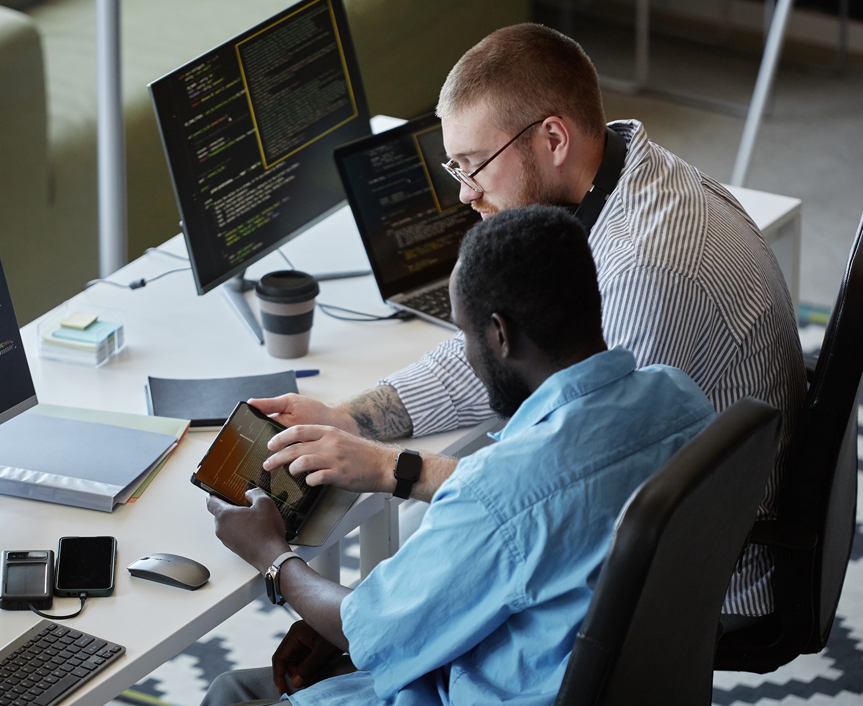 Two colleagues work together on developing software